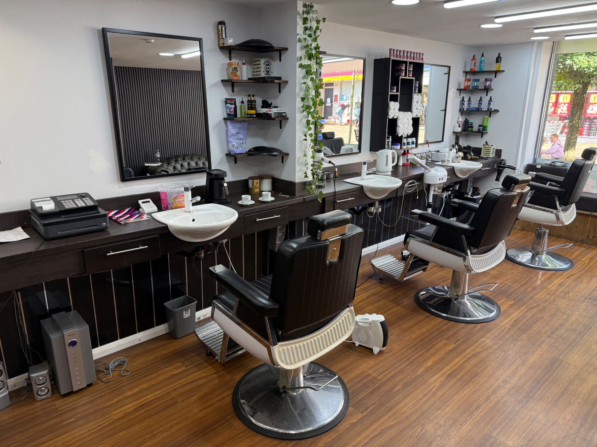 Another view of the barber chairs and styling stations at Dino's Barber Studio