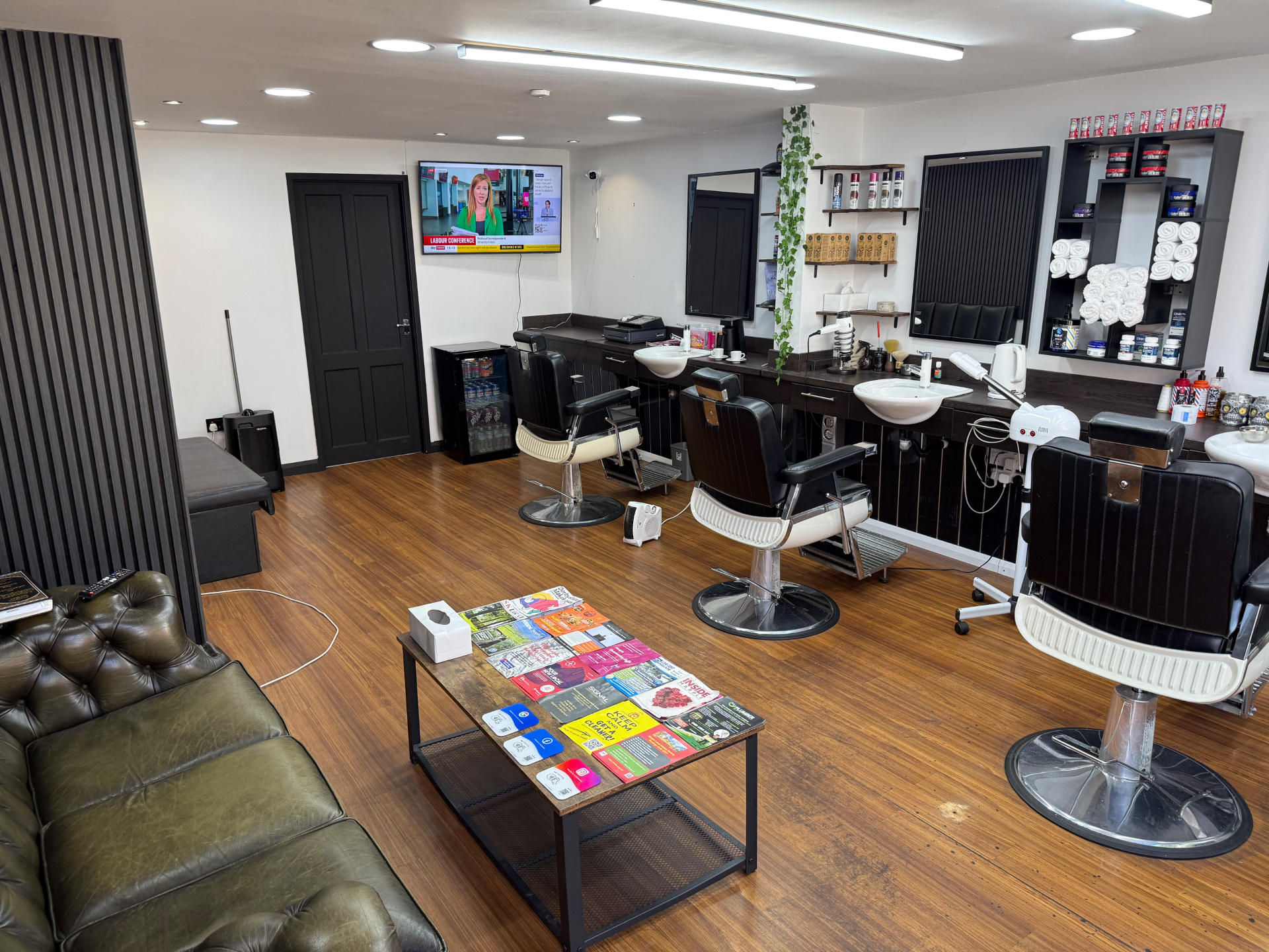 Barber chairs, mirrors and wash stations inside Dino's Barber Studio